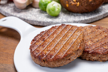 Grilled plant based, meat free vega burgers close up