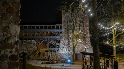 Ruins of Sigulda Medieval Castle, Latvia. Old Fortress Cristmas Time Night Shot.