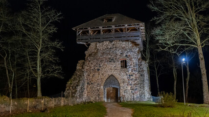 Obraz premium Ruins of Sigulda Medieval Castle, Latvia. Old Fortress Cristmas Time Night Shot.