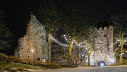 Fototapeta na wymiar Ruins of Sigulda Medieval Castle, Latvia. Old Fortress Cristmas Time Night Shot.