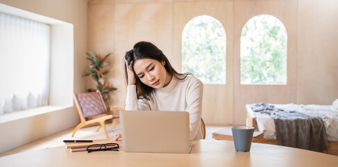 Portrait of stress sad business woman working alone at home office. Business woman work hard lifestyle stress burnout overtime office syndrome, work from home, quarantine coronavirus concept.