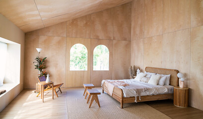 Interior of bedroom with wooden double bed white pillows. wood  wall in the room in rustic cottage....