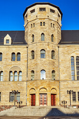 Facade and tower of a historic  Neo-Baroque building with columns