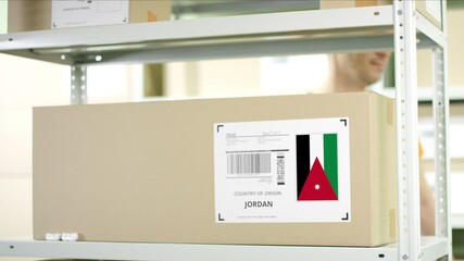 Worker puts a carton with product from Jordan on the shelf - Powered by Adobe