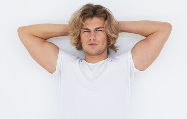 Handsome young man in blank white shirt posing in studio, fashion and people concept.