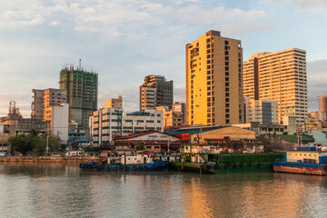 Skyline of Manila behind Pasig river, Philippines.