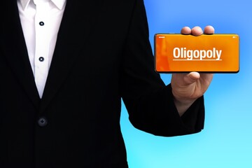 Oligopoly. Lawyer (man) shows a phone. Text appears on the display. Background blue. Hand holds mobile phone.