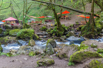 Small stream and an open air restaurant near Rudkhan castle in Iran