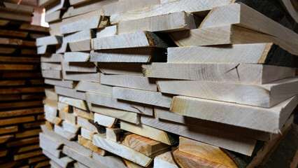stack of rough sawn timber planks construction material