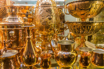 Fototapeta na wymiar ZANJAN, IRAN - APRIL 13, 2018: Brass objects for sale in a shop in Zanjan, Iran.