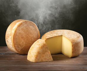 Round parmesan cheese on wood background