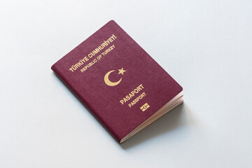  Turkish citizen public passport on the gray background.