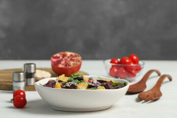 Delicious fresh carrot salad served on white table. Space for text