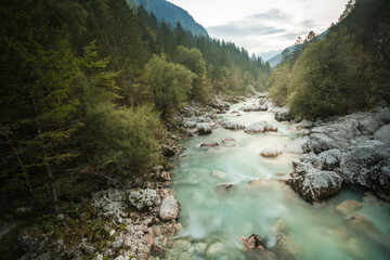 Awesome stream of Soca River with crystal clear turquoise blue water. Late summer and autumn mood...