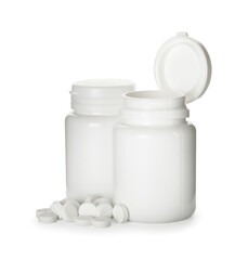 Plastic bottles with pills on white background