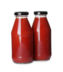 Bottles with tomato juice isolated on white