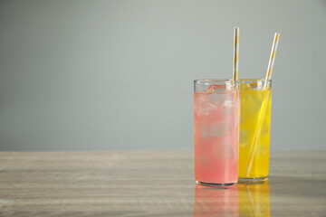 Delicious refreshing drinks on grey table. Space for text
