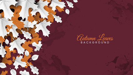 White and Orange Autumn Leaves on Maroon Grunge Background