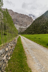 Fototapeta na wymiar Road in Urech valley near Artush village in Fann mountains, Tajikistan
