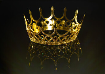 Beautiful golden crown on black background. Fantasy item