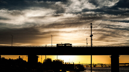 Lonely bus is passing with a passengers who left work.