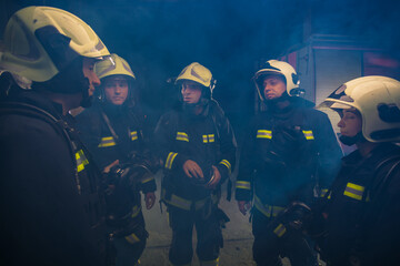 Group of firemen in the fire department organizing action plan for safe execution