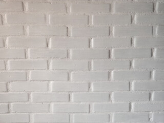neutral white brick wall. painted many times in white. Background image for a poster. Seamless white brick wall texture