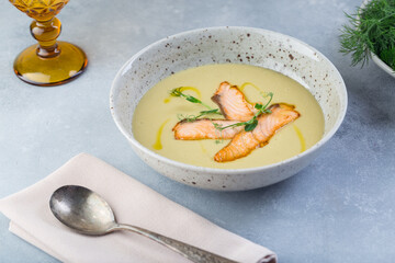 Delicious cream soup with fresh salmon with vegetables and spices. Lunch gourmet