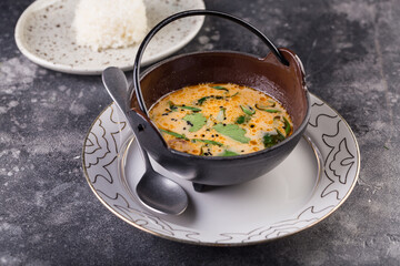 Delicious cream soup with fresh salmon with vegetables and spices. Lunch gourmet