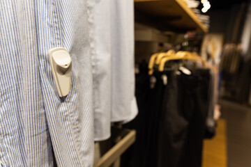 Close-up of RFID theft security tag attached onto apparels in clothing shop