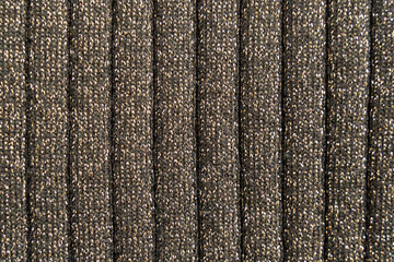 Black and golden textile structure pattern as a background texture