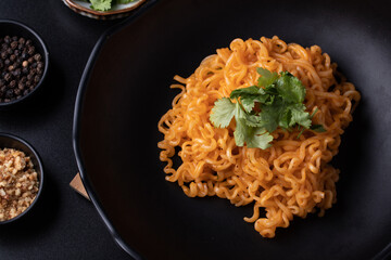 Spicy ramen in black plate