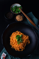 Spicy ramen in black plate