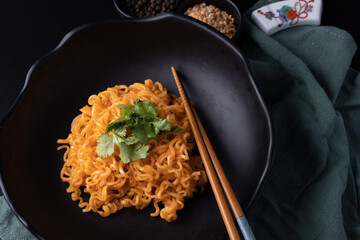Korean dry noodle in black bowl