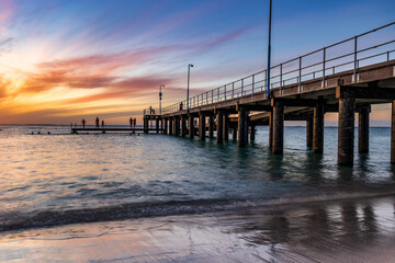 Fototapeta na wymiar Beautiful view of Pier at Sunset, at Coogee Beach, Perth 