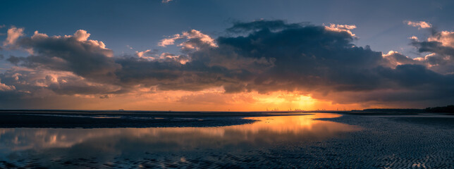 Fototapeta na wymiar Beautiful Panoramic Seaside Sunrise with Cloud Reflections