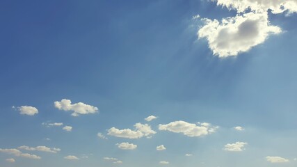the sun's rays break through the cloud in the blue sky © Paulina