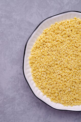 Fine dry pasta in a ceramic dish