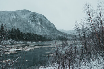 Snowy mountains. next to river in Newfoundland