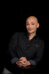 Image of a salesman smiling at you trying to get you to take the deal.