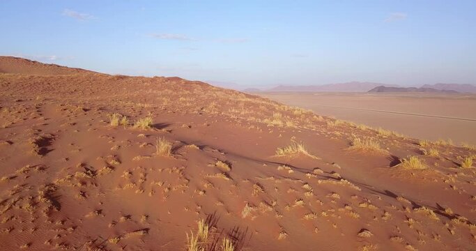 4K aerial drone video of famous endless sand sea and Sossusvlei Namib Desert scenic red sand dunes on sunny afternoon in Namib-Naukluft Park in Namibia, southern Africa