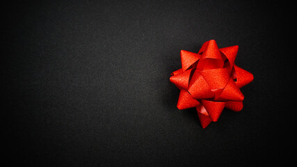 Red sparkling star ribbon on Black background