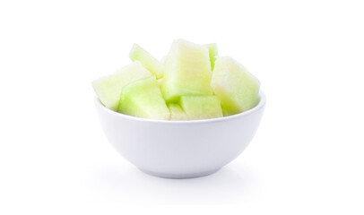 Green melon in white bowl on white background.