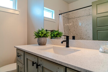 Bathroom interior of home with single basin sink over cabinets and countertop