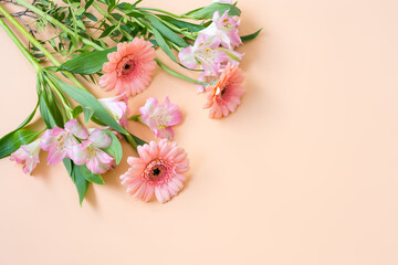 Bouquet of pink gerberas on pink background with copy space