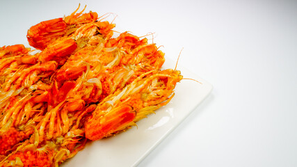 Bear Shrimps (Sclerocrangon salebrosa, Wild Russian Shrimp) on a white plate