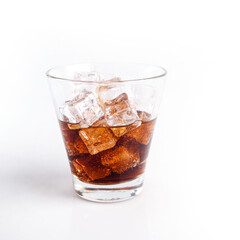 Close-up Cola in glass with ice on white background. - 402783950