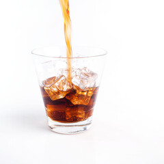 Close-up Cola in glass with ice on white background. - 402783963