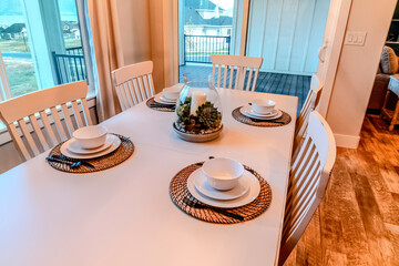 Dining area of home with access to deck with view of houses in the neighborhood
