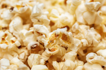Popcorn background. Scattered popcorn. Close up. Abstract background.